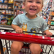 Hadleigh joined the competition — help win amazing prizes! toddler, shopping_cart, grocery_store, smiling, child, snacks, shelves, clothing, happy, indoor, retail, holding, red_handle, shorts, person, cute, cart, store_aisle, young_child, portrait
