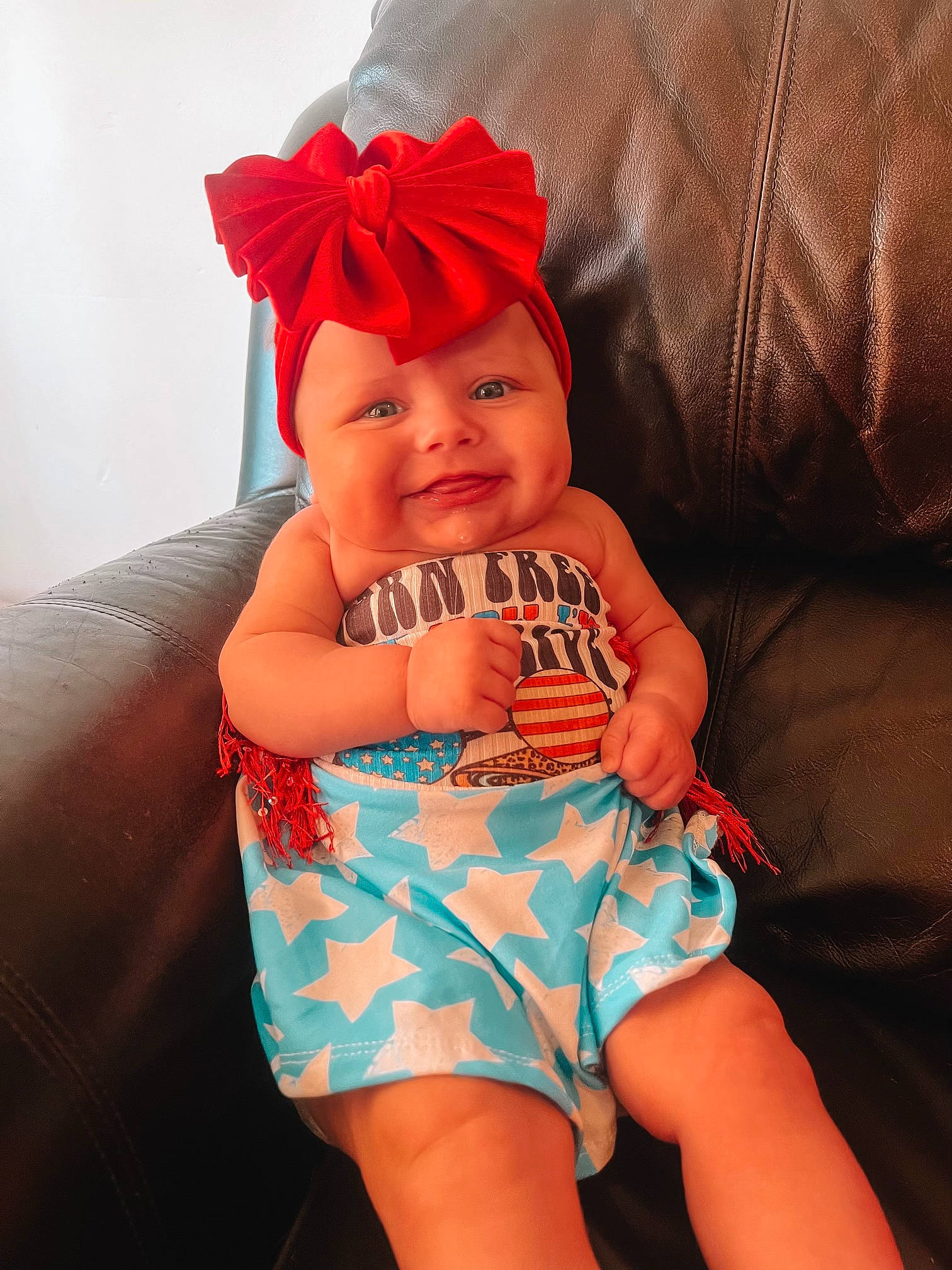 Blaire Avery is registered to the contest to win money with this photo: baby, baby_toddler_clothing, costume_hat, electric_blue, eye, finger, happy, hat, head, headwear, human_body, human_leg, joy, nail, orange, pattern, person, skin, smile, textile