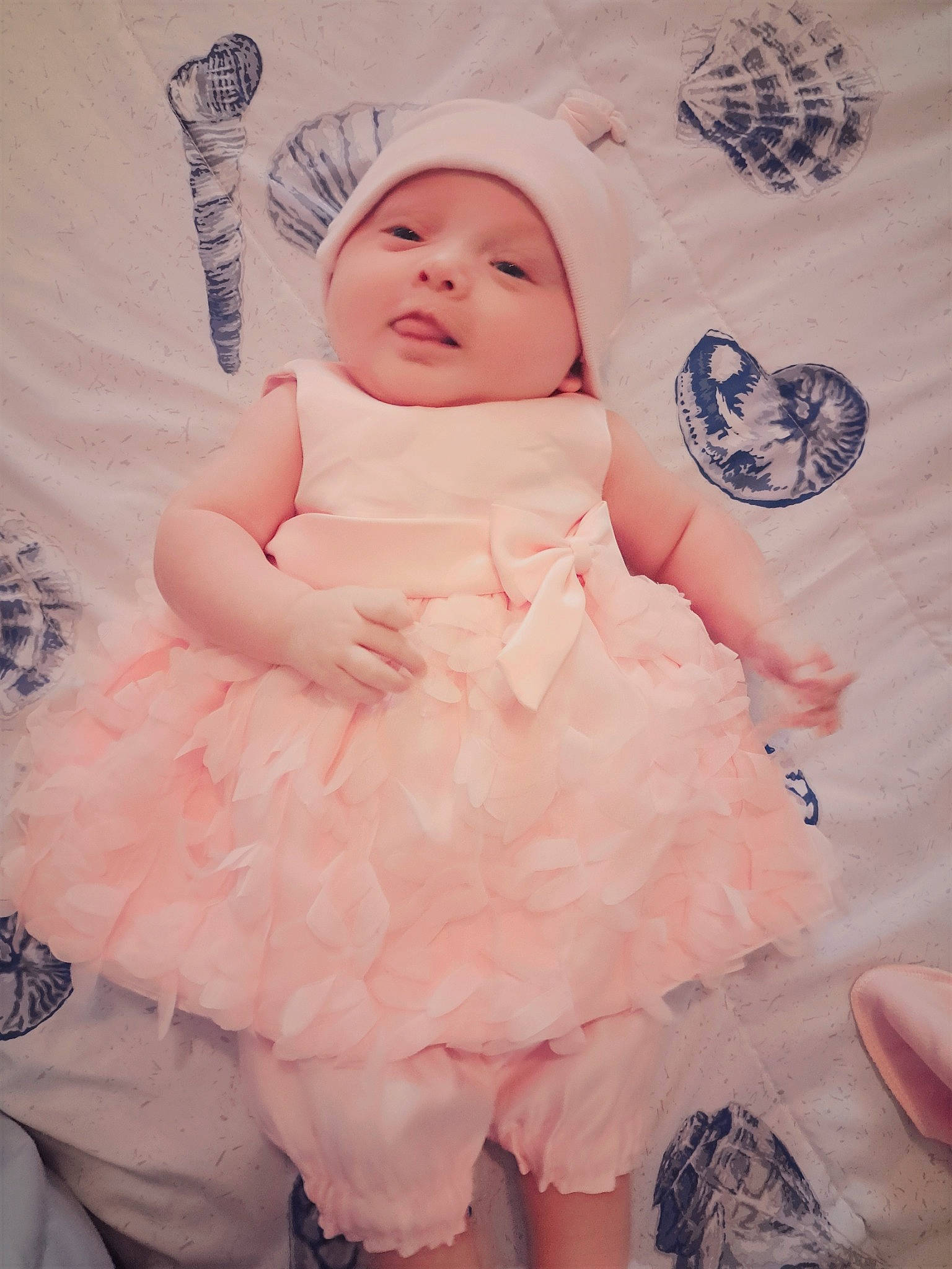 Nevaeh is registered to the contest to win money with this photo: baby, baby_toddler_clothing, child, day_dress, dress, embellishment, face, fashion_design, happy, hat, headwear, linens, pattern, peach, person, pink, ruffle, skin, sleeve, smile