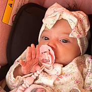 Clara joined the competition — help win amazing prizes! adorable, baby, blanket, bow, car_seat, close_up, cozy, eyes, floral_clothing, hand, headband, infant, newborn, pacifier, pacifier_clip, pink, portrait, skin, soft_tones, warning_label