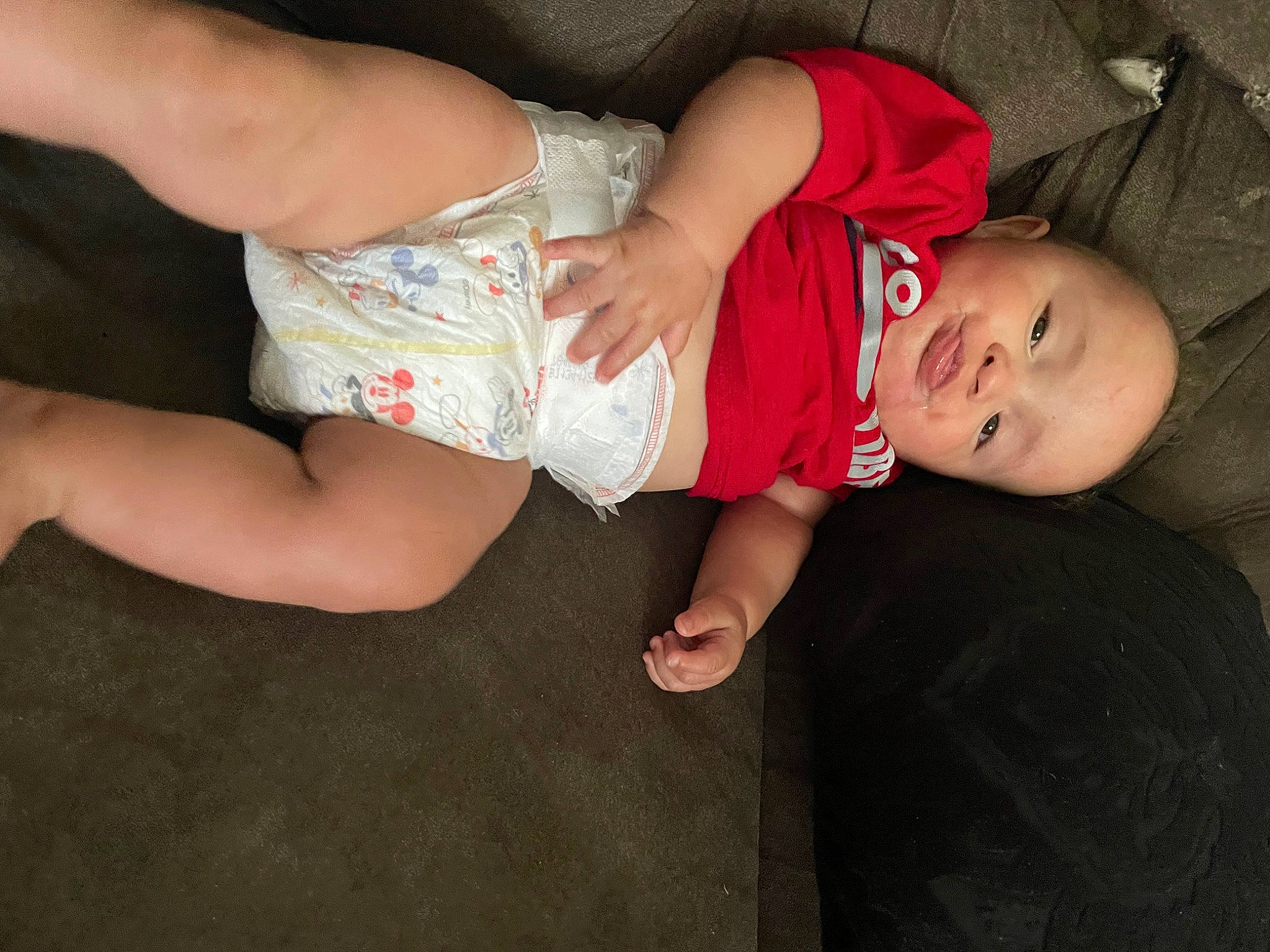 Kentrell is registered to the contest to win money with this photo: baby, baby_toddler_clothing, comfort, elbow, finger, flash_photography, foot, fun, gesture, grass, hand, knee, leg, mouth, person, skin, t_shirt, thigh, toddler, trunk