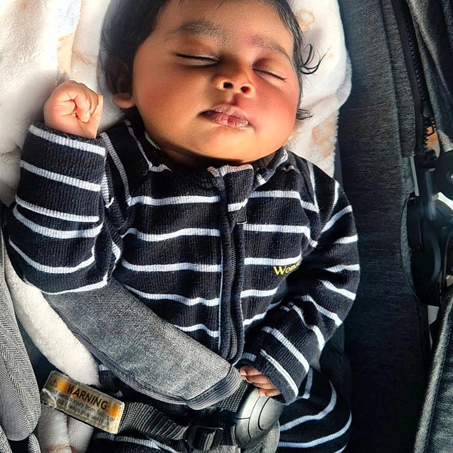 Walaa joined the competition — help win amazing prizes! baby, black_and_white, blanket, car_seat, child, cozy, cute, foot, hand, head, indoors, infant, peaceful, portrait, resting, safety_harness, sleeping, soft_texture, striped_clothing, young_child