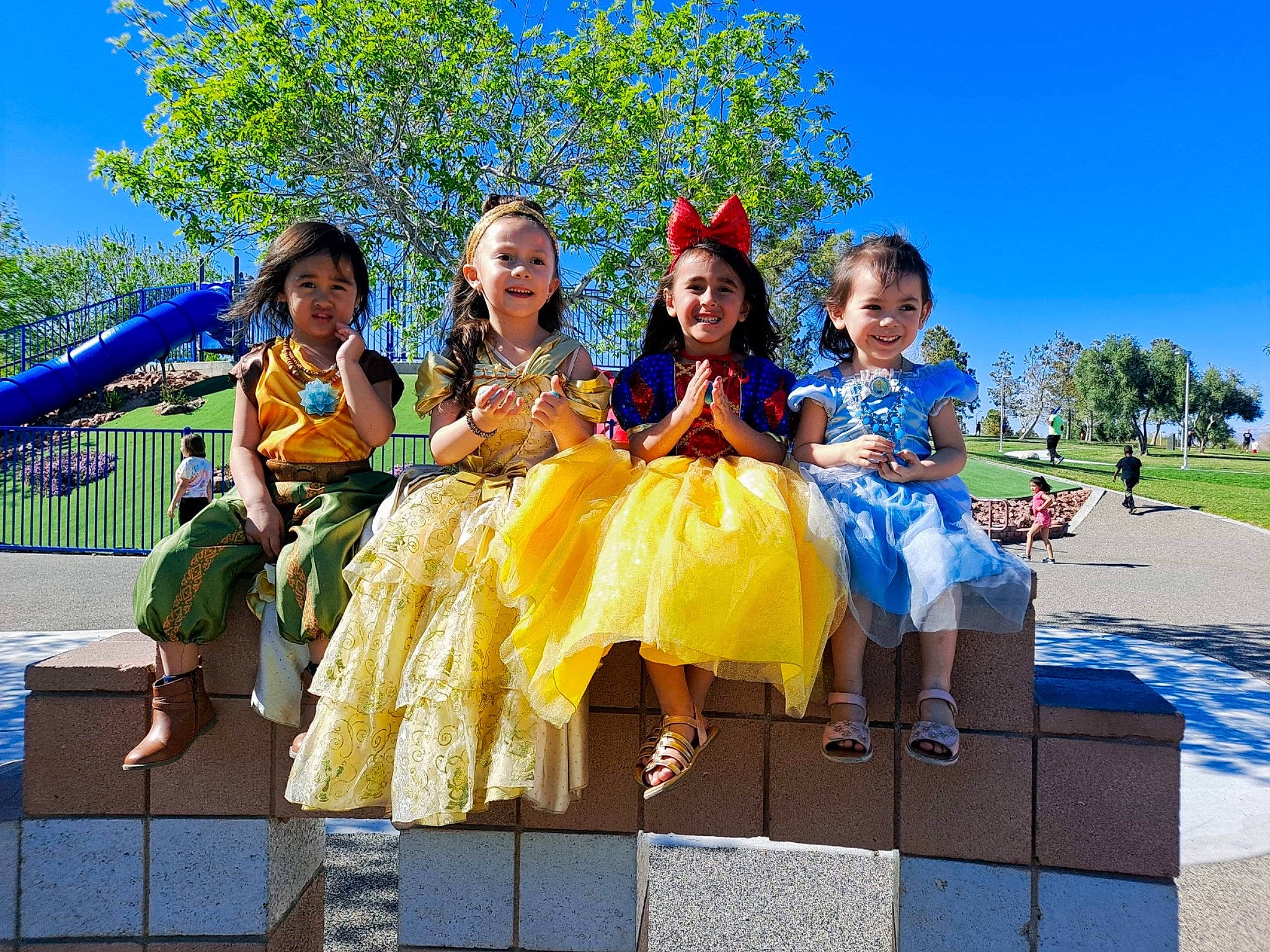 Elaina Kauhi is registered to the contest to win money with this photo: blue, child, costume, event, flower, fun, grass, happy, joy, leisure, person, plant, pole, public_event, recreation, sky, smile, team, tourism, travel