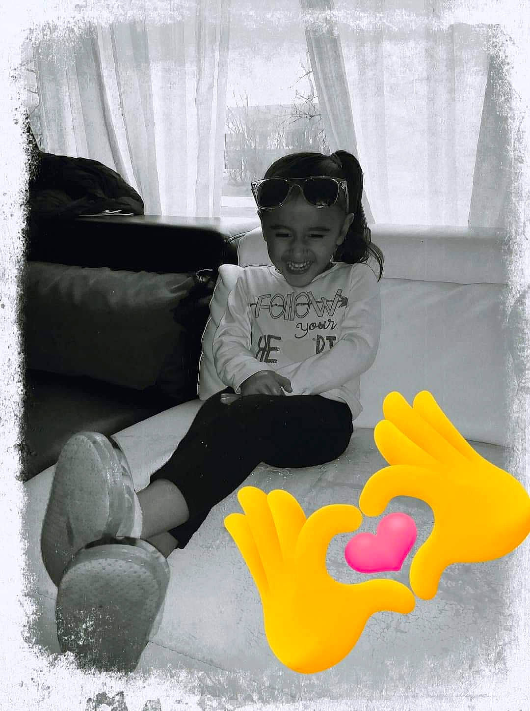 Elaina Moana'Ilikea Kauhi joined the competition — help win amazing prizes! black, black_and_white, child, cool, headwear, joy, leg, person, photography, pillow, room, shoe, sitting, smile, snapshot, style, t_shirt, textile, toddler, white