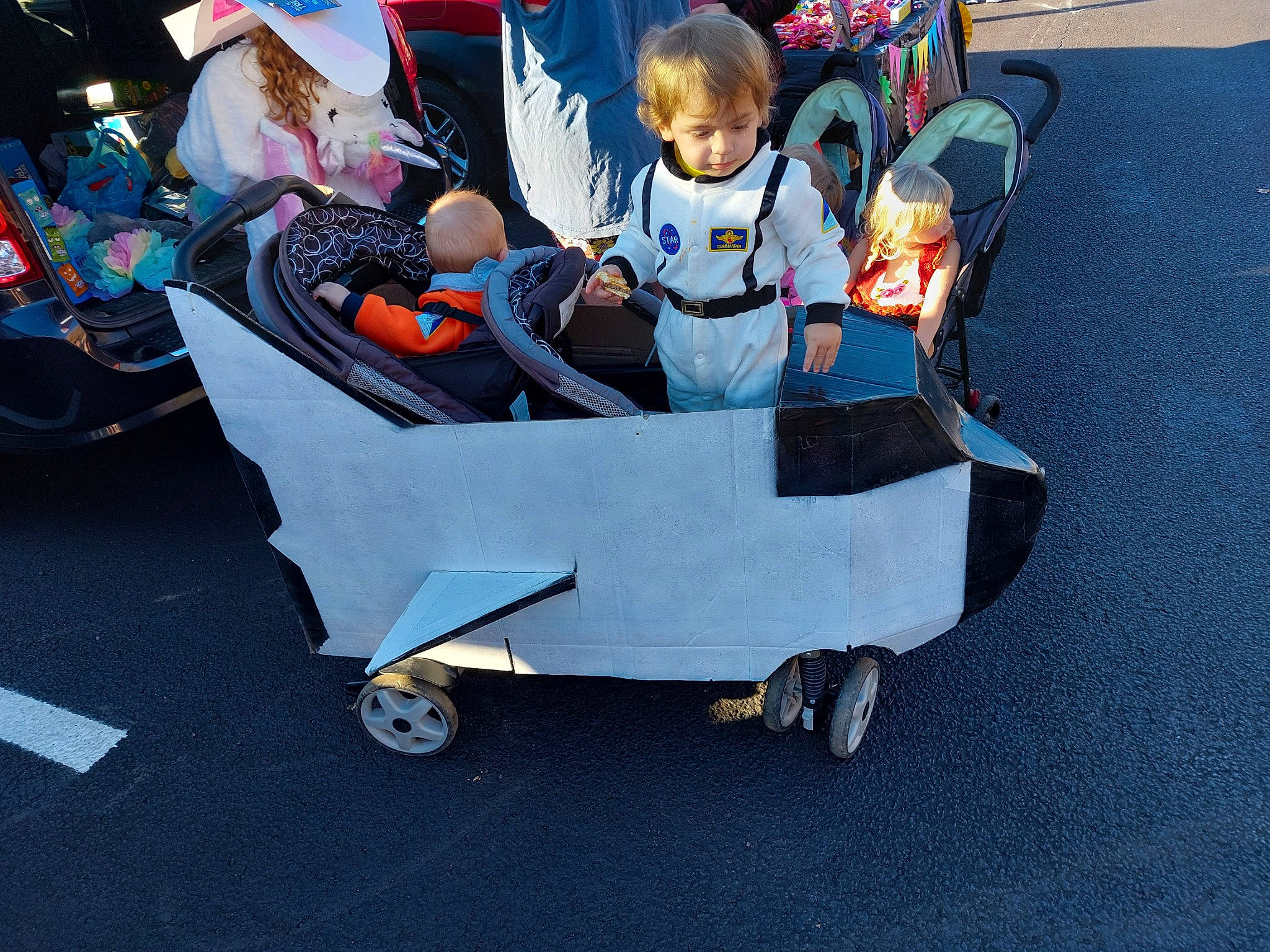 Kash joined the competition — help win amazing prizes! asphalt, auto_part, automotive_design, automotive_exterior, automotive_wheel_system, baby_carriage, baby_products, electric_blue, event, fun, leisure, mode_of_transport, motor_vehicle, person, recreation, rolling, t_shirt, tire, toddler, travel