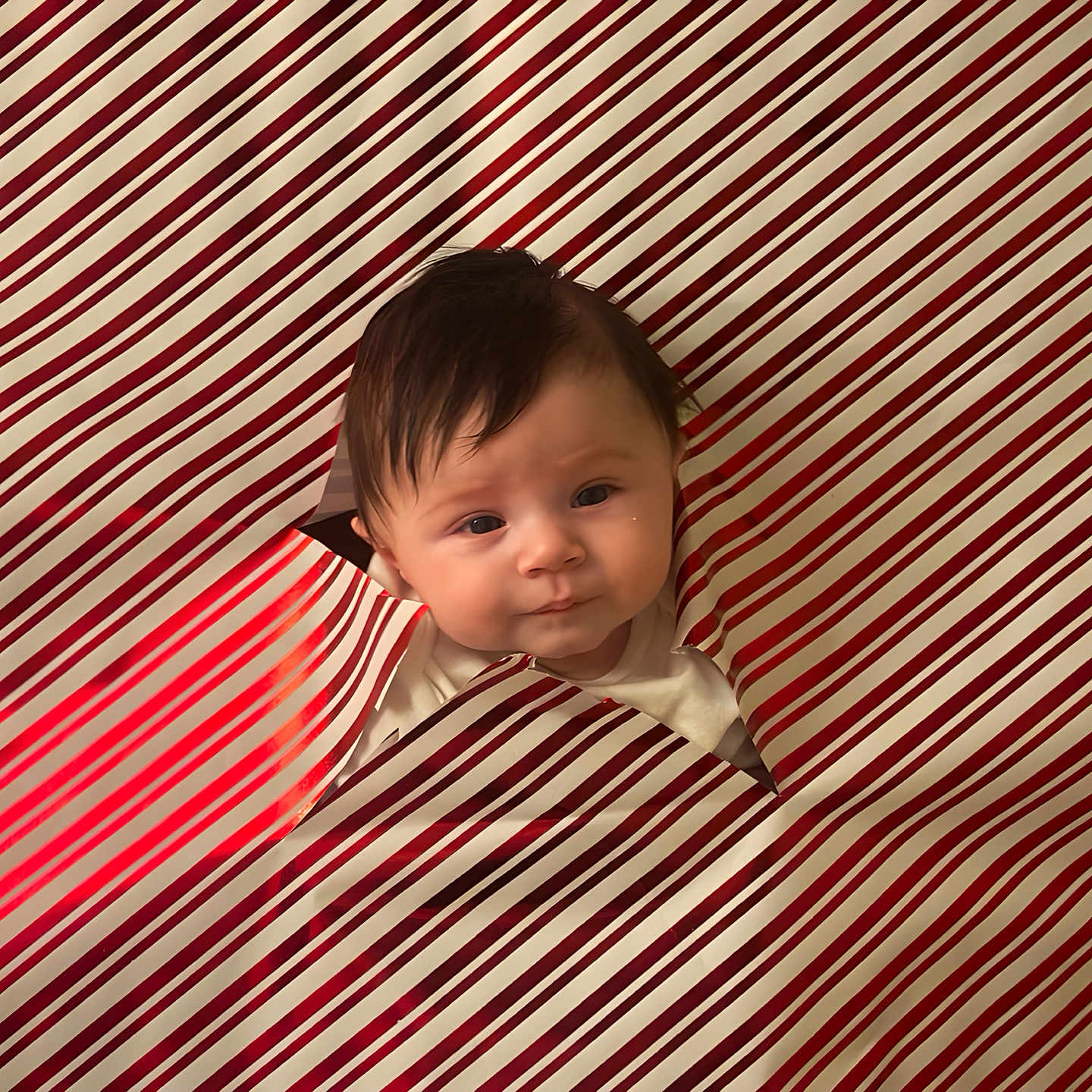 Theodore joined the competition — help win amazing prizes! baby, blanket, bodypart, clothing, dress, face, finger, formalwear, furniture, hand, happy, head, hiding, mouth, newborn, pattern, person, photography, portrait, smile