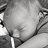 baby, infant, sleeping, nap, portrait, black_and_white, peaceful, cozy, blanket, textile, close_up, face, head, closed_eyes, ear, cheek, arm, snuggling, indoor, monochrome