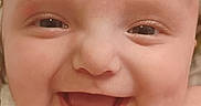 Karliah is registered to the contest to win money with this photo: baby, blanket, cheeks, child, close_up, cute, expression, eyes, face, happy, head, human, infant, joyful, mouth, portrait, skin, smiling, soft, young