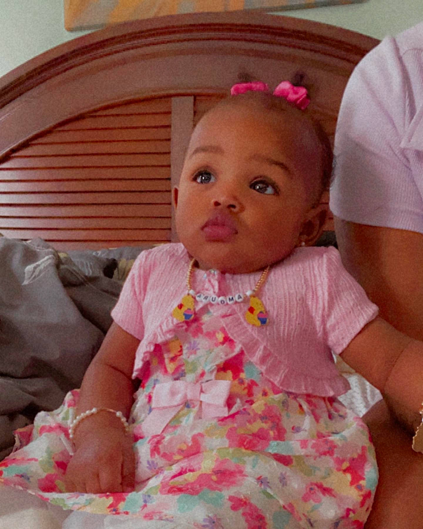 Amoura is registered to the contest to win money with this photo: baby, baby_toddler_clothing, cheek, chin, dress, ear, eye, facial_expression, hair, hairstyle, happy, human_body, iris, lip, mouth, nose, person, pink, skin, sleeve