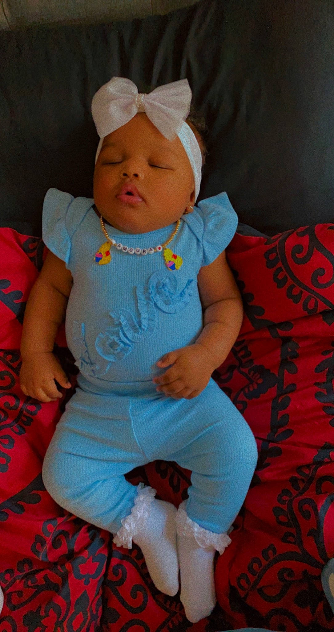 Amoura joined the competition — help win amazing prizes! baby, baby_products, baby_toddler_clothing, cheek, child, comfort, electric_blue, eye, fun, happy, head, headwear, linens, pattern, person, pink, sitting, skin, sleeve, t_shirt