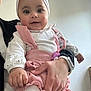 adult_hand, baby, casual_clothing, child, closeup, cute, face, hand, happy, headband, holding, indoor, infant, love, person, pink_outfit, portrait, smile, white_tights, young_child