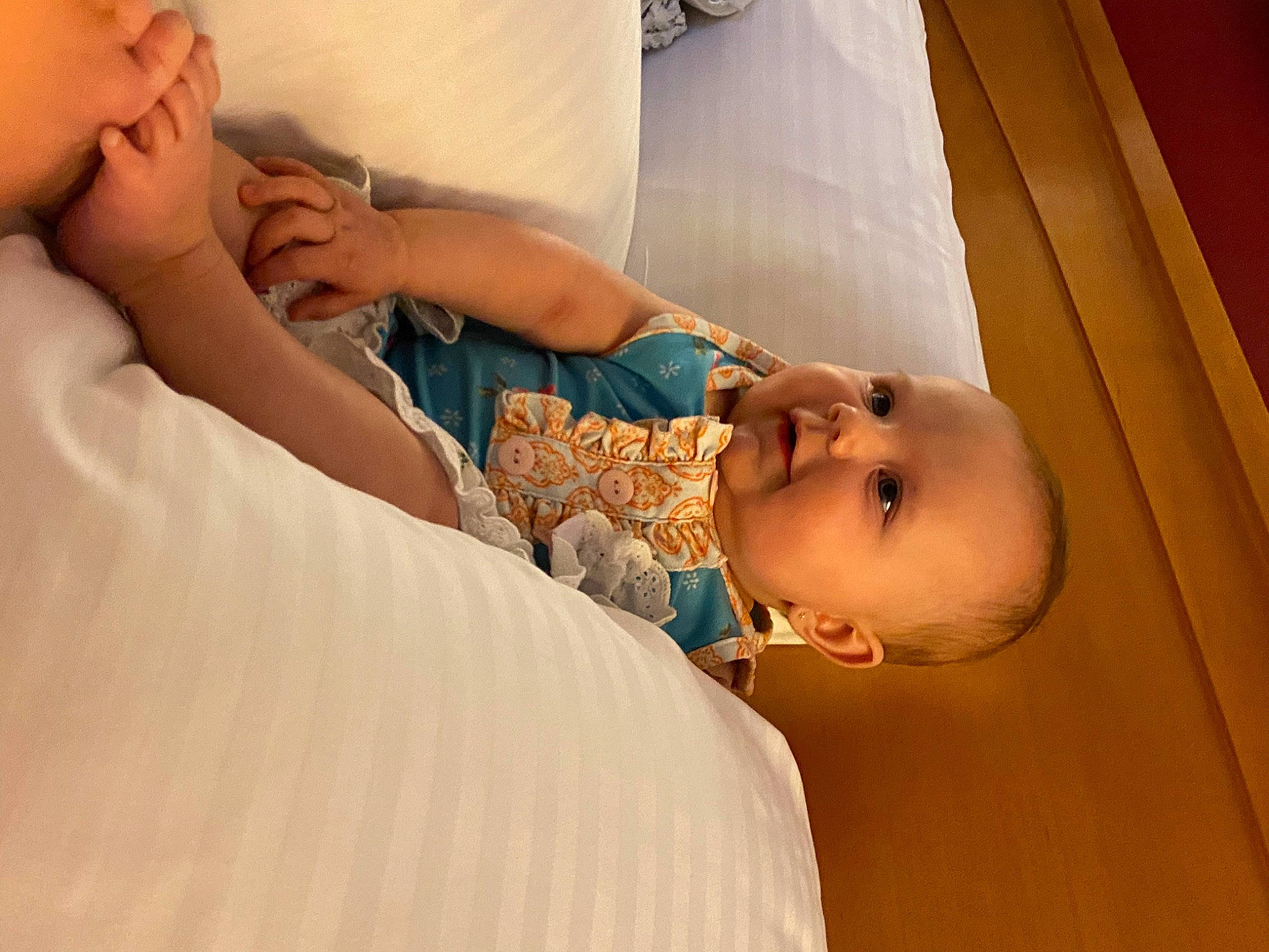 Adley is registered to the contest to win money with this photo: abdomen, arm, baby, cheek, chest, child, comfort, ear, eyebrow, eyelash, gesture, hand, happy, human_body, linens, neck, nose, person, skin, toddler