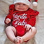 baby, infant, smile, red_clothing, santa_hat, christmas, holiday, cute, lying_down, blanket, soft_texture, festive, happy, child, skin, hand, foot, indoors, portrait, cozy