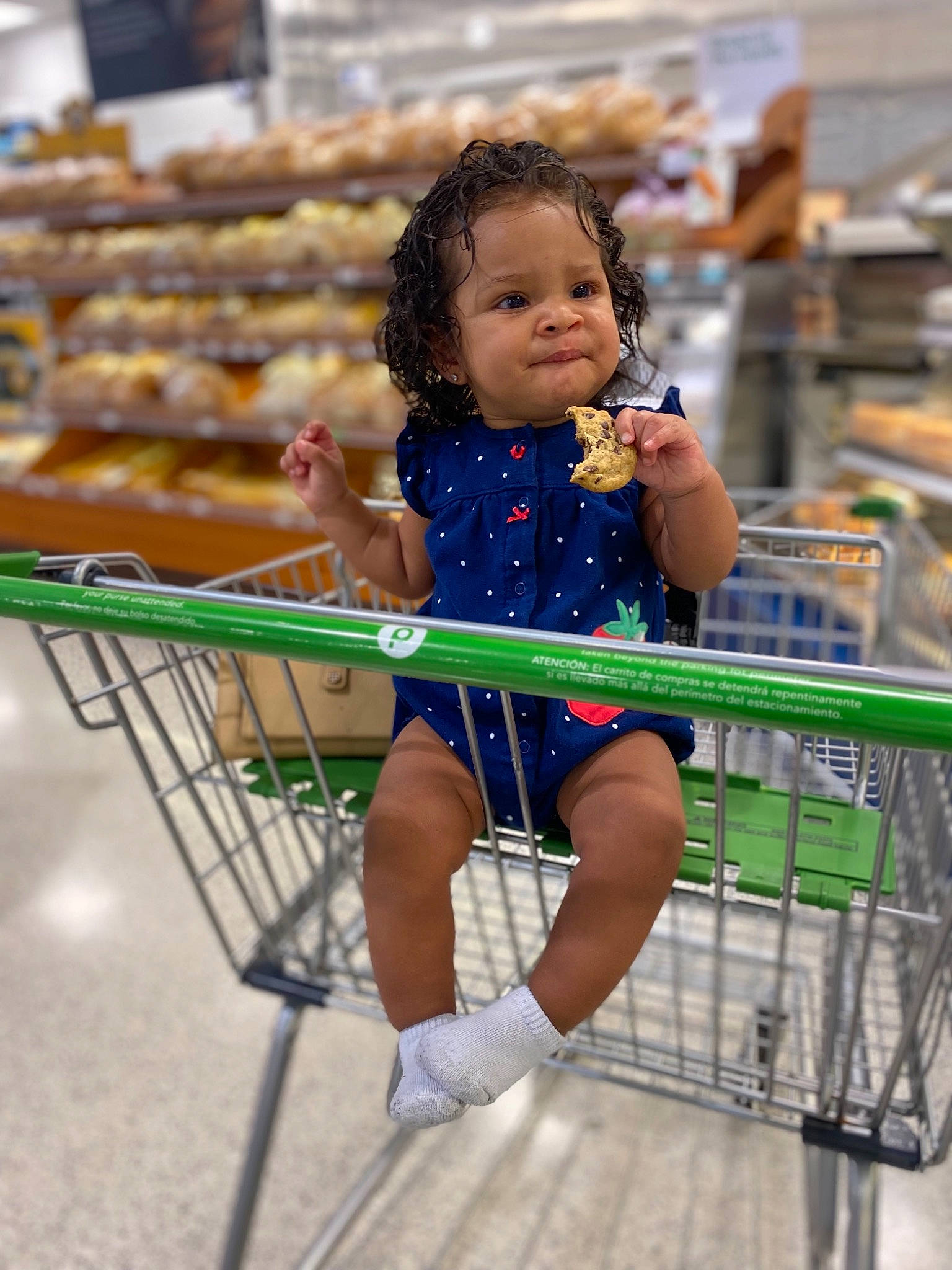 Zendaya is registered to the contest to win money with this photo: child, city, customer, electric_blue, fun, happy, human_body, human_leg, leisure, person, recreation, retail, shopping, shopping_cart, smile, street_fashion, t_shirt, thigh, tire, toddler