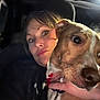 woman, dog, car_interior, selfie, close_up, night, hand, red_nails, collar, leash, face, eyes, expression, seat, jacket, portrait, pet, animal, human, indoor