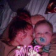 Ace joined the competition — help win amazing prizes! baby, child, person, cuddle, bed, blanket, pacifier, red_hair, sleeping, resting, indoor, cozy, hug, close_up, portrait, human, comfort, expression, text_overlay, nighttime