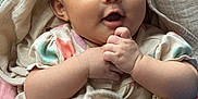 Fandana joined the competition — help win amazing prizes! baby, child, infant, cloth, blanket, hand, face, smile, happy, person, fabric, wrapped, cute, skin, head, sitting, indoors, colorful, accessory, soft