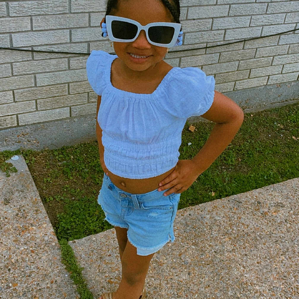 Nayomi joined the competition — help win amazing prizes! accessories, blouse, brick, child, clothing, face, female, footwear, girl, glasses, head, pants, path, person, photography, portrait, sandal, shorts, summer, sunglasses