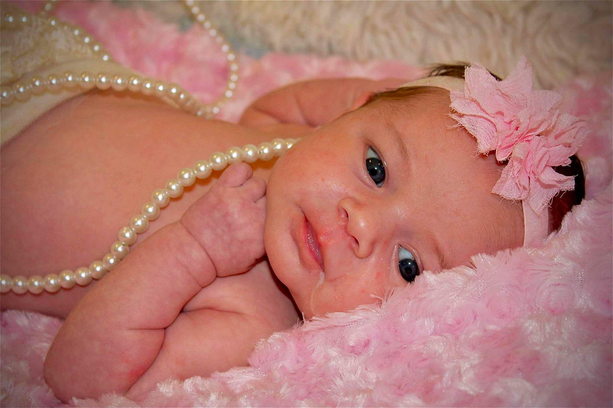 Mallorie is registered to the contest to win money with this photo: baby, cheek, eye, eyebrow, eyelash, face, finger, flash_photography, happy, head, headgear, headwear, human, iris, lip, mouth, nose, person, pink, skin