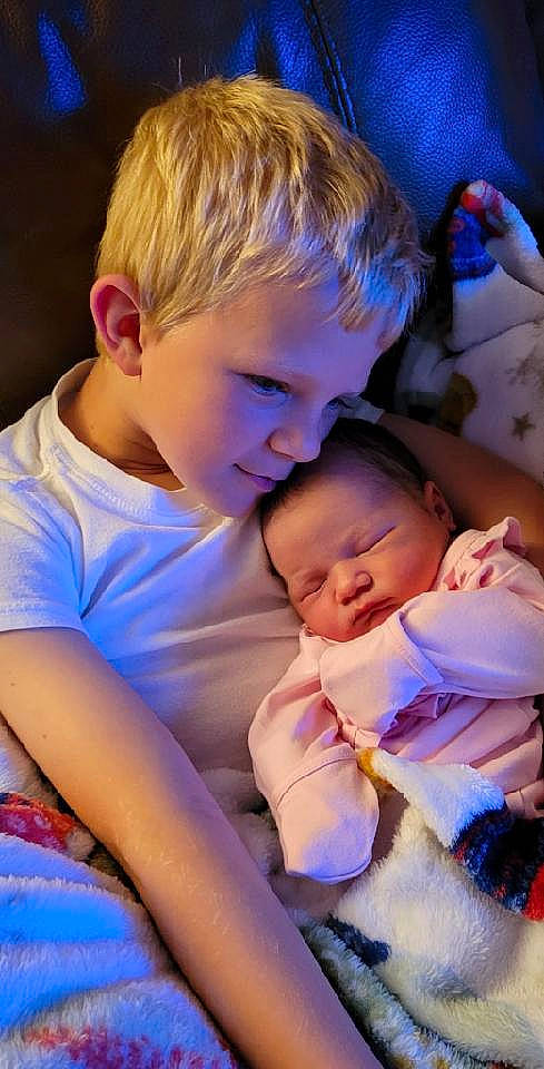 Mallorie joined the competition — help win amazing prizes! arm, baby, baby_toddler_clothing, blue, cheek, eye, face, facial_expression, hairstyle, happy, head, human_body, interaction, iris, mouth, muscle, nose, person, purple, skin