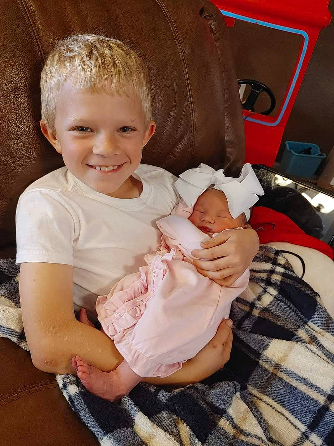 Mallorie joined the competition — help win amazing prizes! baby, baby_toddler_clothing, cheek, child, comfort, finger, happy, human_leg, joint, joy, lap, leg, mammal, person, sitting, skin, sleeve, smile, t_shirt, tartan