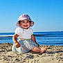 Alma a rejoint le concours — aidez-le/la à gagner de superbes lots ! baby, child, beach, sand, ocean, sky, sunhat, smiling, happy, sitting, water, summer, outdoor, clothing, foot, sparkly_skirt, nature, sunny, cute, portrait