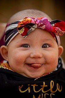 Kyleigh is registered to the contest to win money with this photo: baby, baby_laughing, cheek, cool, eye, eyebrow, forehead, happy, head, headgear, headpiece, headwear, iris, joy, lip, magenta, mouth, nose, person, pink