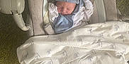 Luca joined the competition — help win amazing prizes! newborn, baby, sleeping, hat, blanket, baby_rocker, carpet, clothing, infant, cozy, resting, indoor, cute, soft, peaceful, wrapped, toddler, child, person, nursery