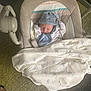 newborn, baby, sleeping, hat, blanket, baby_rocker, carpet, clothing, infant, cozy, resting, indoor, cute, soft, peaceful, wrapped, toddler, child, person, nursery