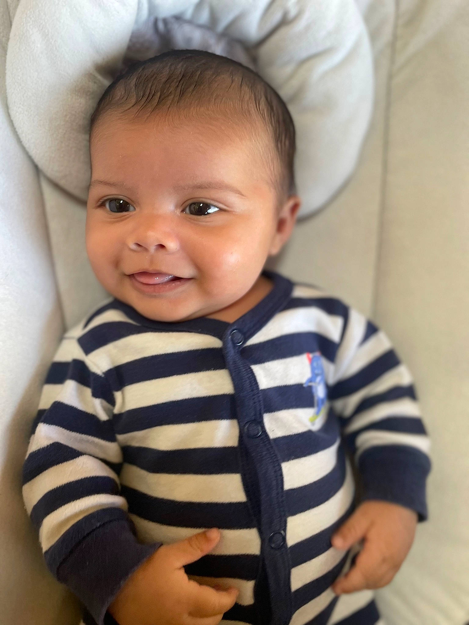 Logan is registered to the contest to win money with this photo: baby, baby_toddler_clothing, cheek, chin, eye, eyebrow, eyelash, face, facial_expression, flash_photography, hairstyle, head, iris, joy, lip, neck, person, product, skin, sleeve