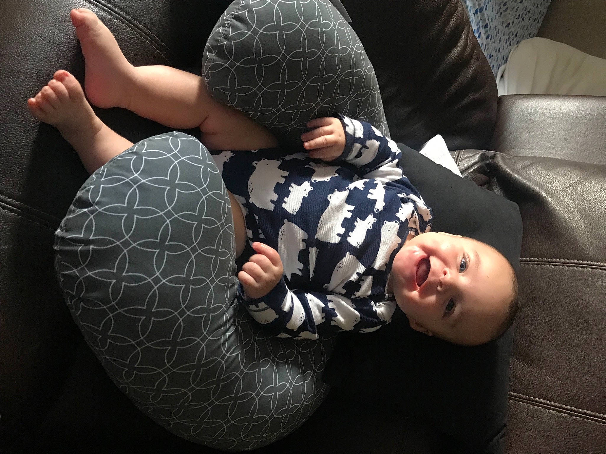 Reese is registered to the contest to win money with this photo: baby, child, comfort, cool, couch, darkness, elbow, flash_photography, flooring, fun, gesture, headgear, human_leg, interaction, mouth, pattern, person, personal_protective_equipment, sitting, thigh