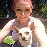 Lottie joined the competition — help win amazing prizes! blue_sky, casual_clothing, cute, daylight, dog, earrings, grass, greenery, harness, nature, necklace, outdoor, pet, pink_hair, portrait, relaxed, smiling, sunlight, tree, woman