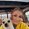 animal, car_interior, casual, companion, cute, dog, friendly, happy, harness, indoor, pet, portrait, seat, selfie, small_dog, smile, sunroof, window, woman, yellow_hoodie