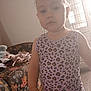 Elysianna participe au concours pour gagner de l'argent avec cette photo : casual, child, clothing, couch, drying_rack, expressionless, floor, furniture, hair, indoor, leopard_print, light, pattern, person, room, shoes, standing, tank_top, toddler, window