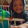Quilan joined the competition — help win amazing prizes! toddler, child, baby, hoodie, smile, hand, crib, indoor, furniture, curtains, face, person, happy, playful, baby_toy, home, young_child, portrait, skin, clothing
