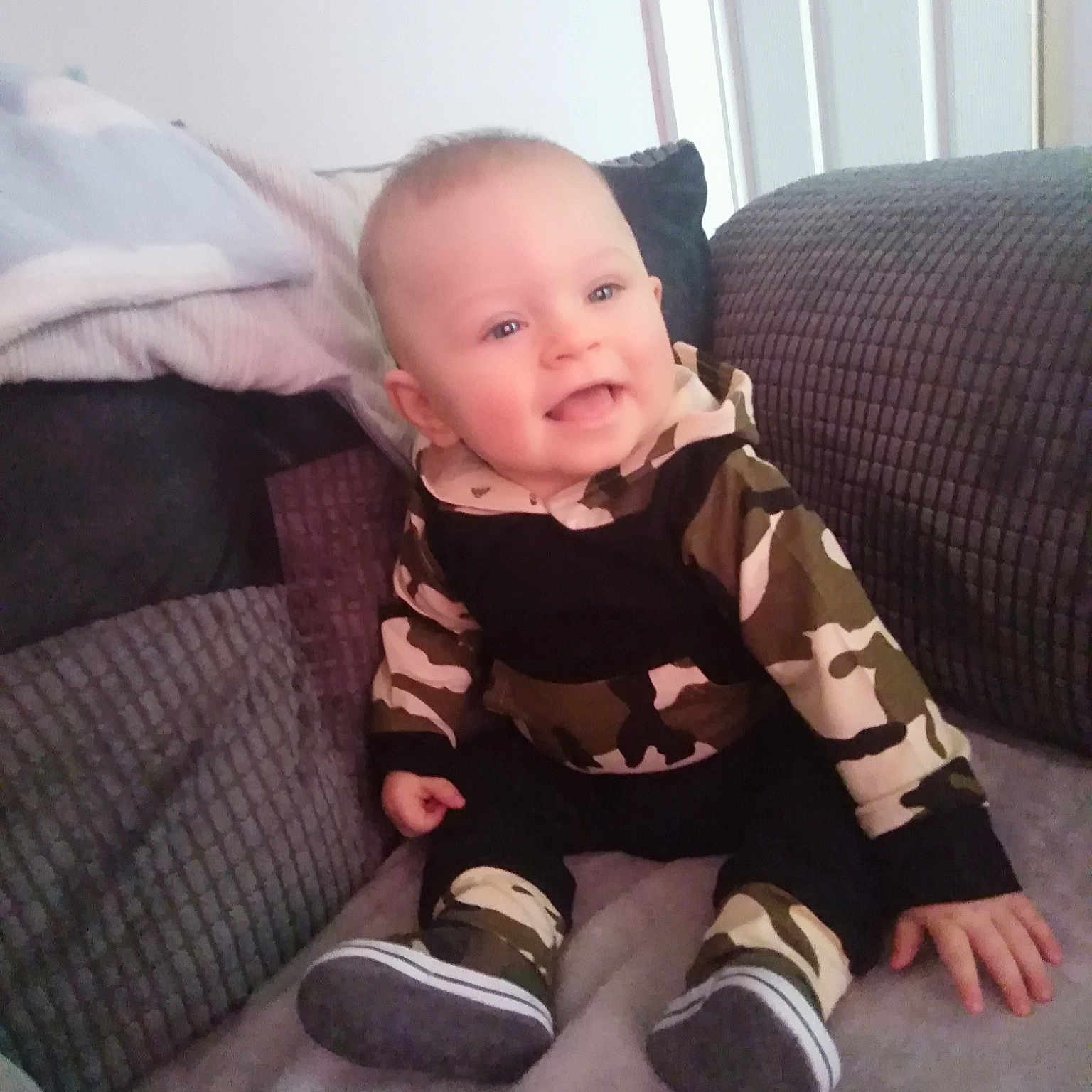 Kyden joined the competition — help win amazing prizes! baby, cheek, child, electronic_device, face, head, person, room, sitting, skin, smile, toddler