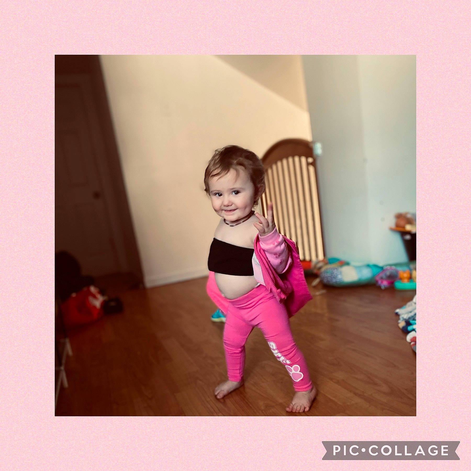 Maëlla Bonsaint a rejoint le concours — aidez-le/la à gagner de superbes lots ! active_pants, baby, baby_toddler_clothing, dress, floor, flooring, happy, hardwood, human_leg, joy, knee, leg, magenta, person, sleeve, sportswear, t_shirt, thigh, toddler, trunk