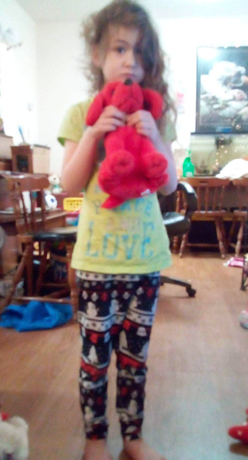 Aleah joined the competition — help win amazing prizes! chair, child, costume, event, fashion_design, flooring, fun, fur, happy, human_leg, knee, pattern, person, room, selfie, shoulder, stuffed_toy, t_shirt, thigh, toy