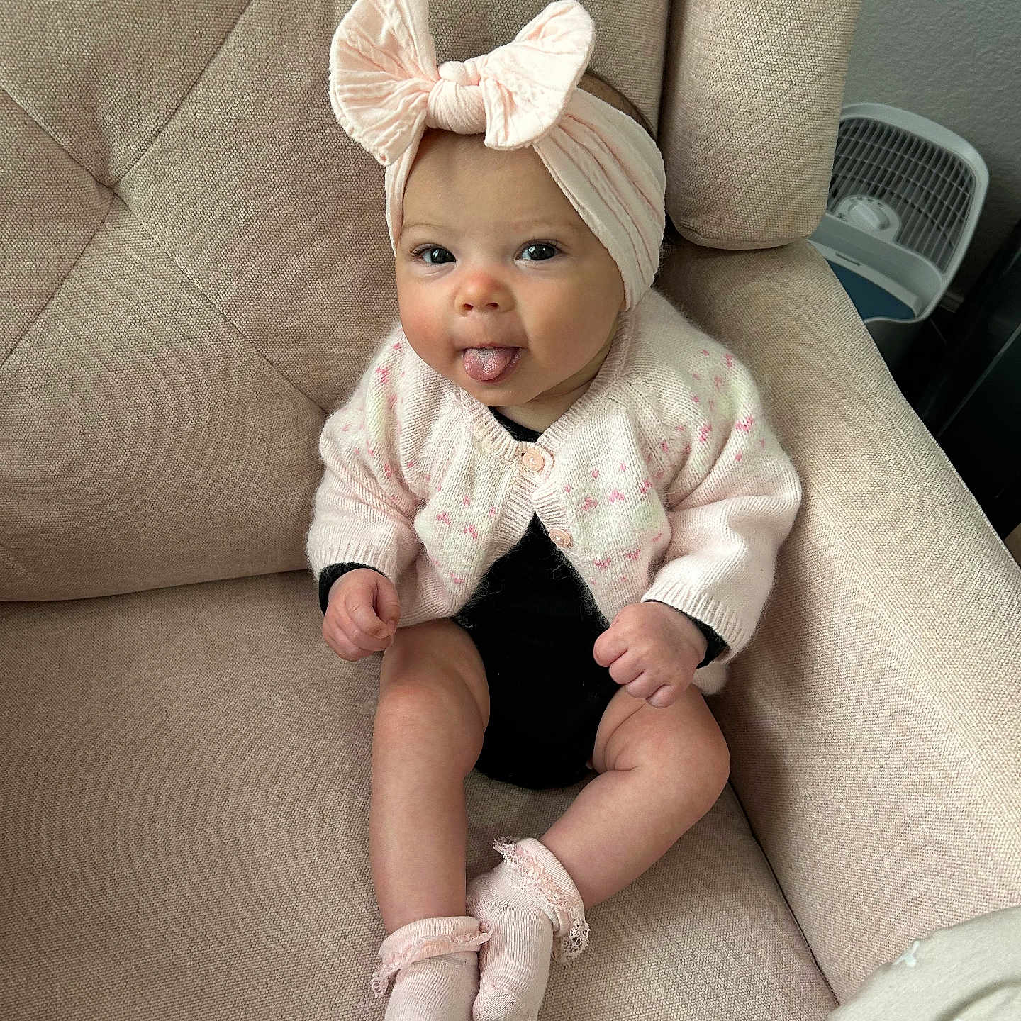 Ryan is registered to the contest to win money with this photo: baby, bodypart, bonnet, cap, chair, clothing, couch, cushion, face, finger, furniture, hat, head, homedecor, hosiery, person, photography, portrait, sitting, sock