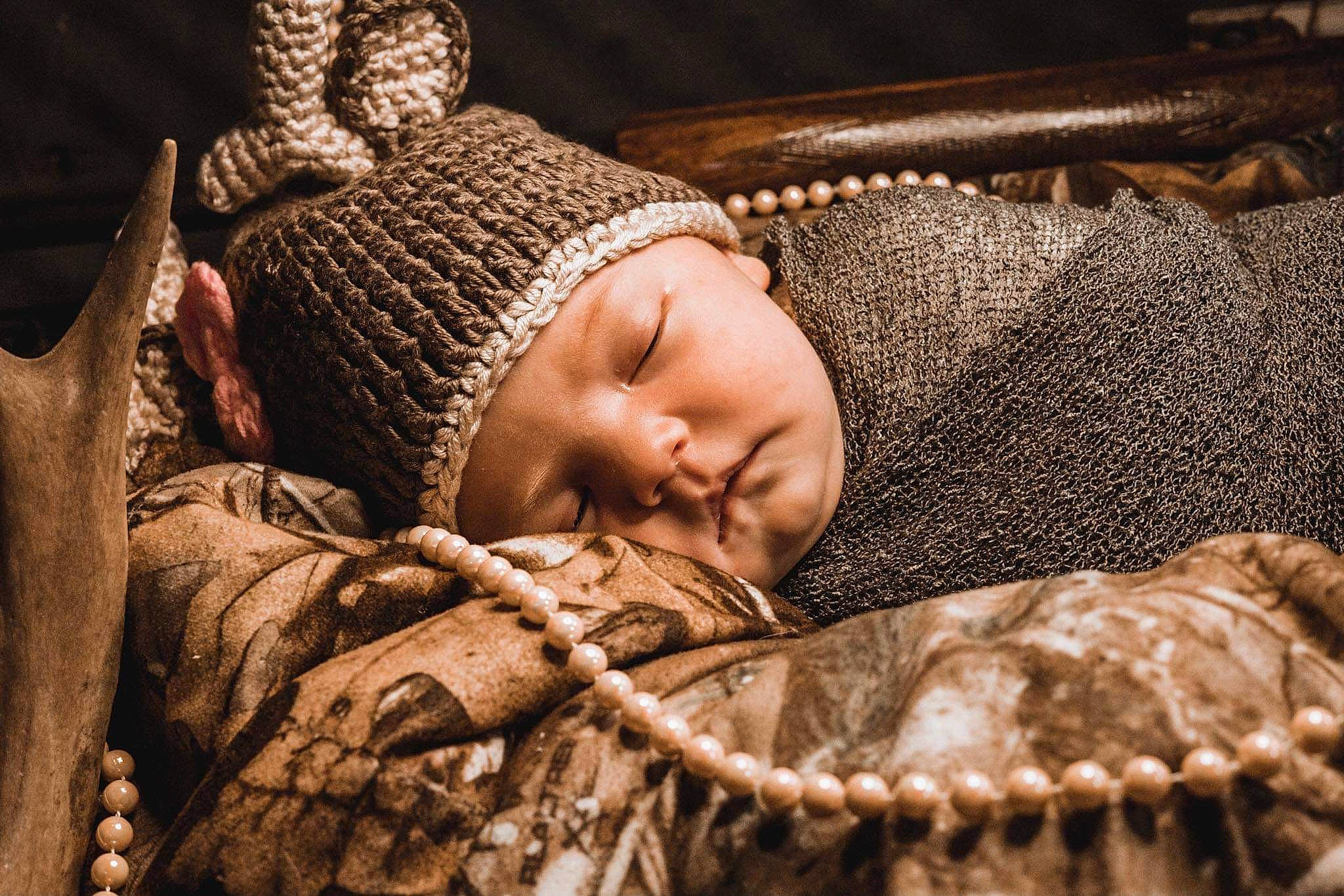 Bryleigh is registered to the contest to win money with this photo: baby, baby_sleeping, beanie, bedding, bedtime, cap, cheek, child, comfort, flash_photography, fur, headgear, headwear, knit_cap, linens, nap, pattern, person, textile, toddler