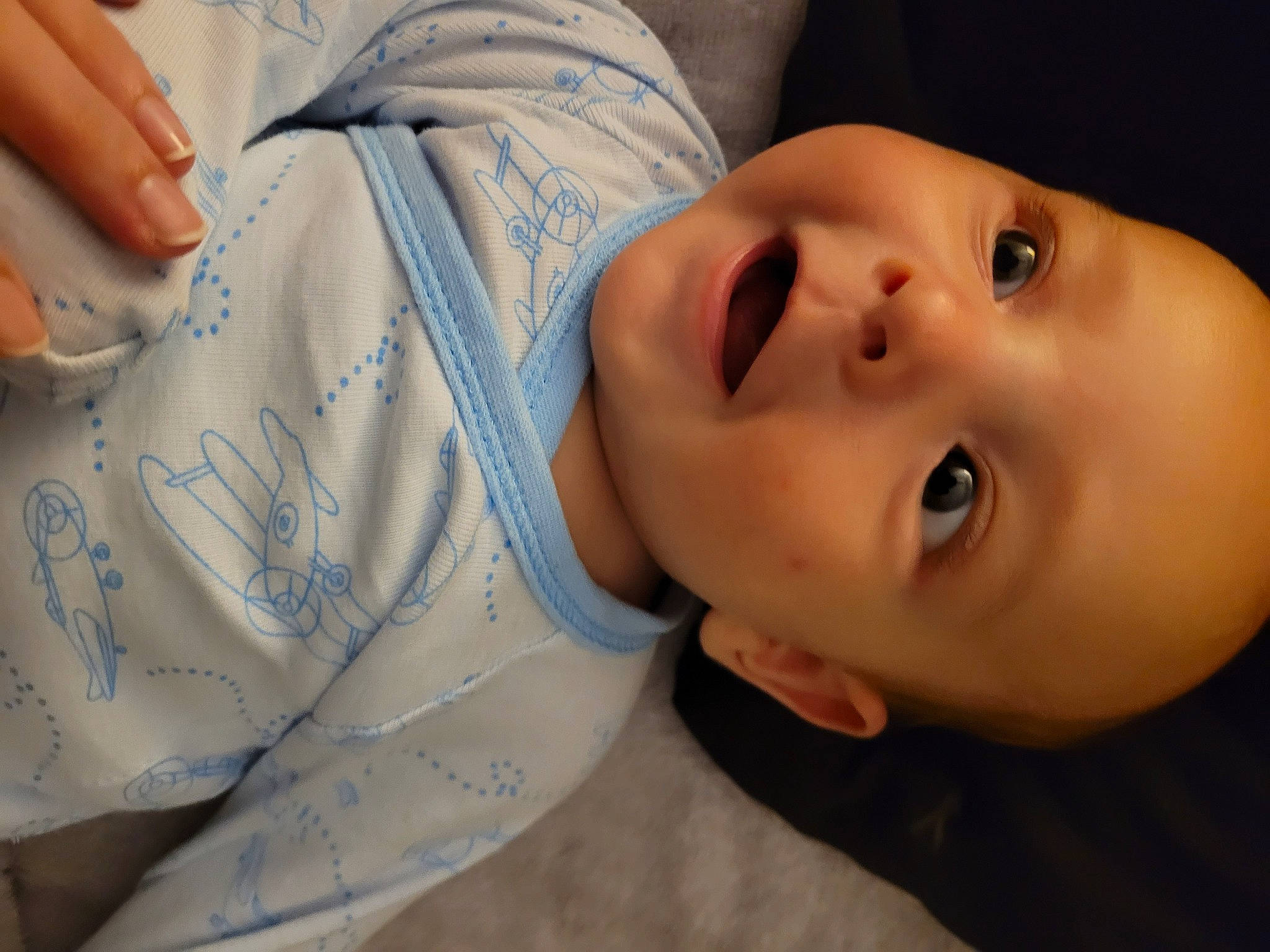 Alexander is registered to the contest to win money with this photo: arm, baby, baby_toddler_clothing, cheek, child, chin, eye, eyebrow, eyelash, finger, gesture, hand, happy, human_body, lip, mouth, neck, nose, person, skin