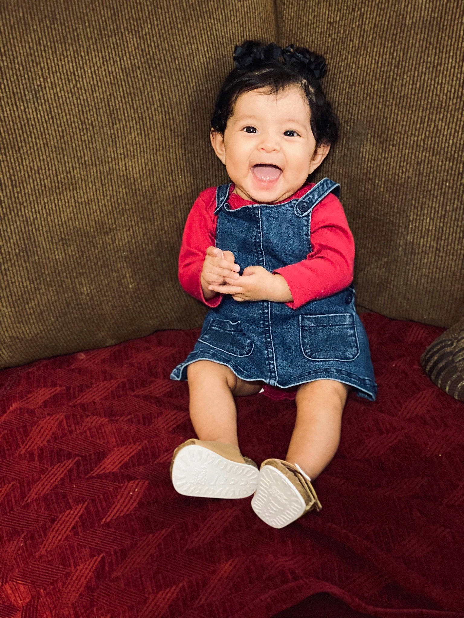 Daleyza is registered to the contest to win money with this photo: arm, baby, baby_toddler_clothing, cheek, comfort, dress, face, finger, flash_photography, flooring, hair, happy, human_body, iris, neck, person, skin, sleeve, smile, toddler