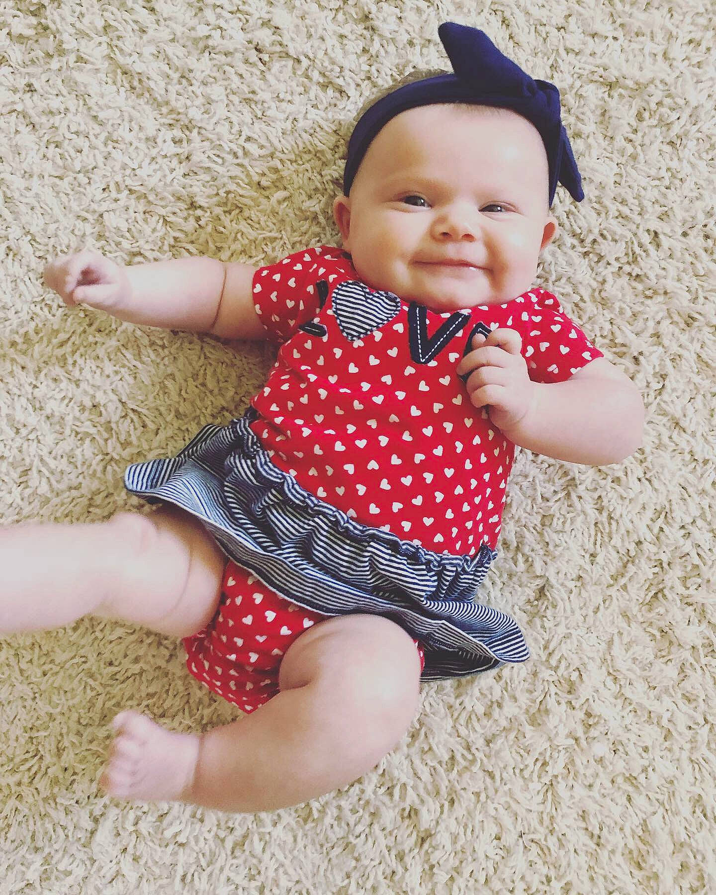 Delanie is registered to the contest to win money with this photo: baby, baby_products, baby_toddler_clothing, child, child_model, design, headgear, pattern, person, plaid, play, polka_dot, skin, sleeve, smile, toddler