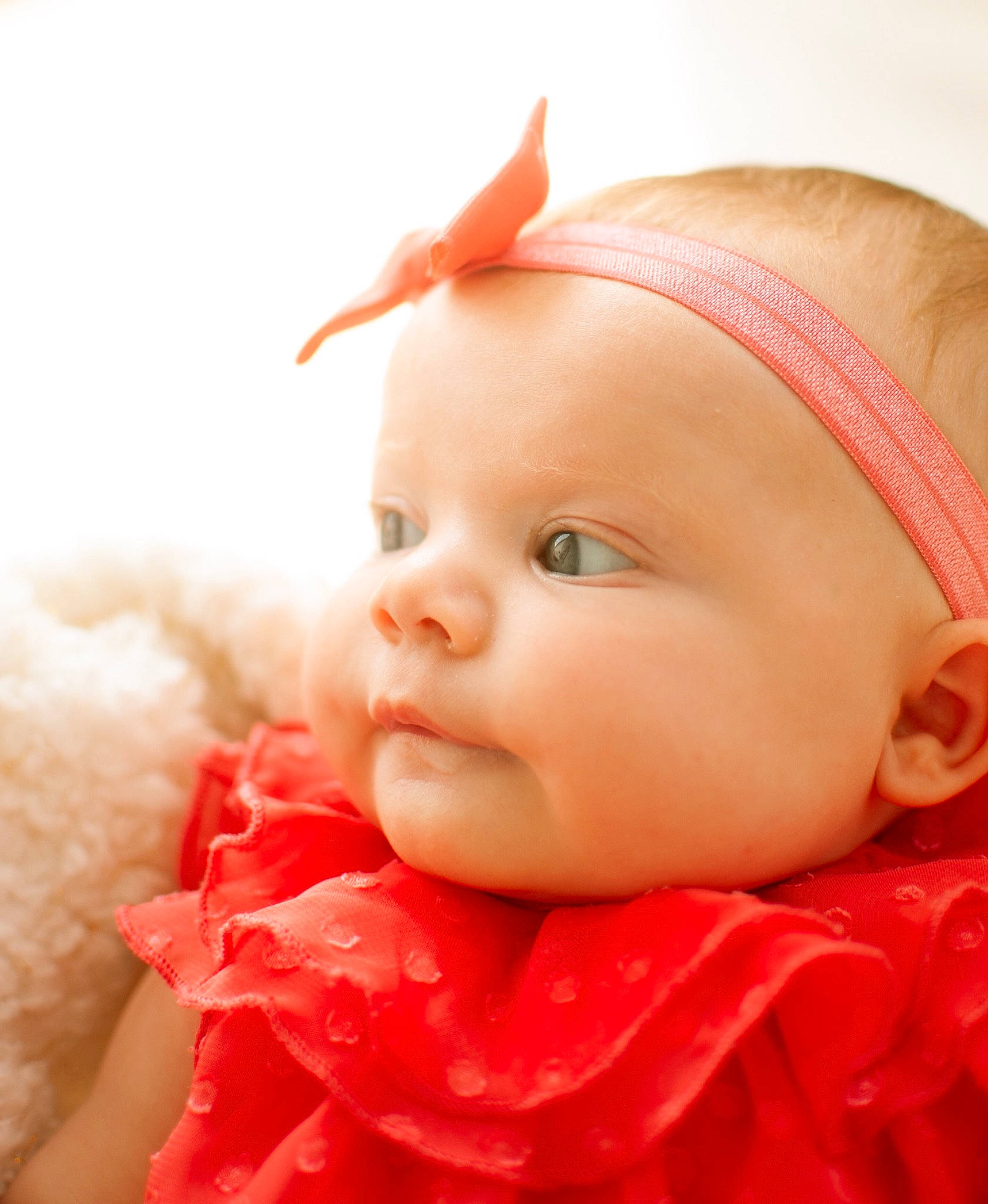 Delanie is registered to the contest to win money with this photo: baby, beauty, cheek, child, close_up, eye, face, hair_accessory, head, headgear, lip, mouth, nose, peach, person, photography, pink, portrait_photography, red, skin
