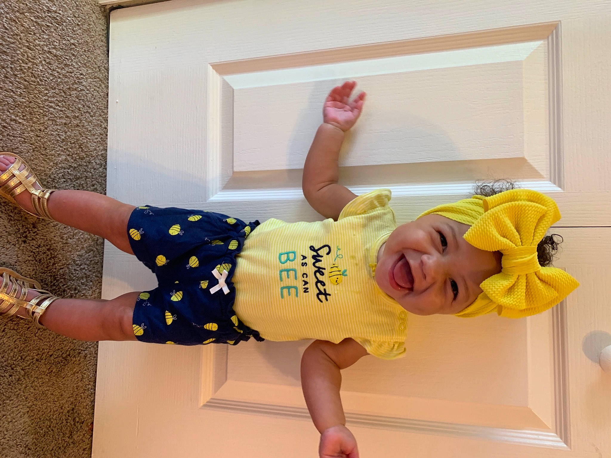 Nai Yeli joined the competition — help win amazing prizes! baby, baby_laughing, baby_toddler_clothing, child, finger, fun, happy, headwear, human_leg, leg, person, play, room, sandal, sleeve, smile, t_shirt, textile, thigh, toddler