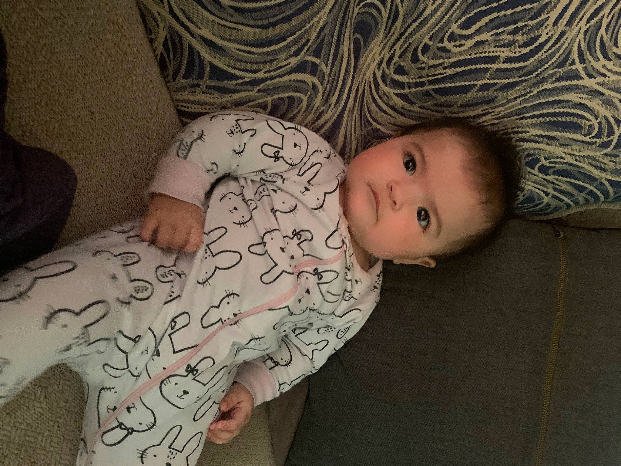 Kennedy is registered to the contest to win money with this photo: arm, baby, baby_toddler_clothing, cheek, comfort, eye, eyebrow, face, hairstyle, hand, head, headgear, human_body, iris, mammal, mouth, nose, person, skin, sleeve