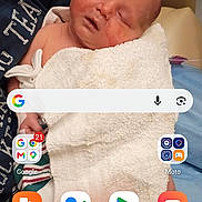 Nevaeh Davis joined the competition — help win amazing prizes! baby, sleeping, towel, person, arm, phone_screen, app_icons, advertisement, word_jumble, indoor, closeup, human, child, blanket, comfortable, resting, mobile, technology, screen, casual