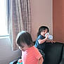 Andrew And Peter joined the competition — help win amazing prizes! child, toddler, indoor, furniture, chair, ottoman, curtains, window, sippy_cup, clothing, black_leather, wall, playing, movement, barefoot, hair, room, person, home, activity