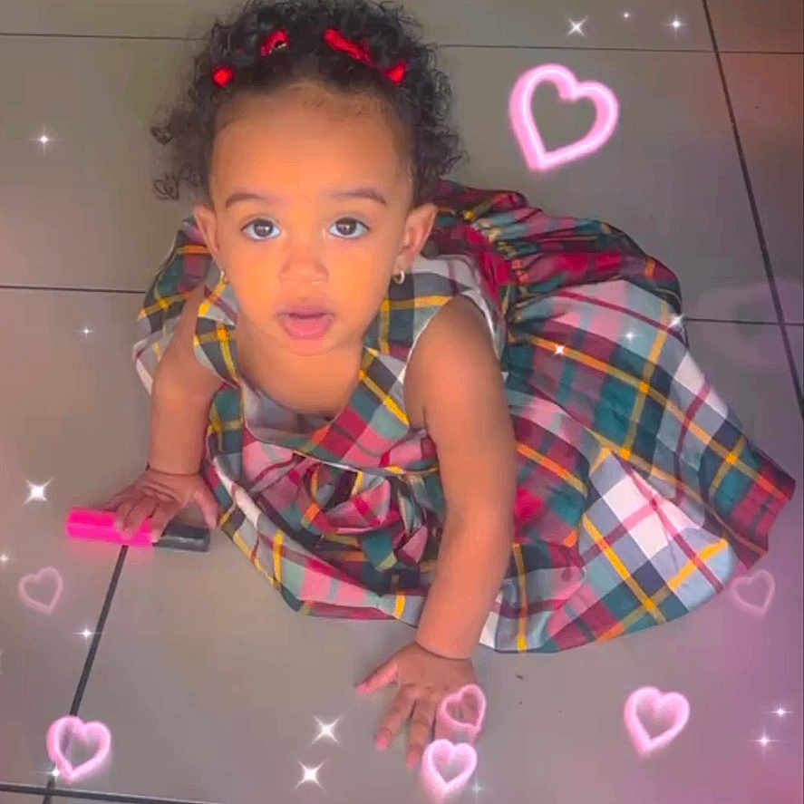 Gabiellies joined the competition — help win amazing prizes! child, comment_box, curly_hair, cute, earrings, floor_tiles, hair_bows, hearts_filter, indoor, looking_up, photo_filter, pink_marker, plaid_dress, portrait, sitting, social_media_ui, sparkles, tile_floor, toddler, toy