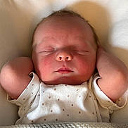 Maxwell joined the competition — help win amazing prizes! newborn, baby, sleeping, infant, arms_up, onesie, polka_dots, blanket, knitted, soft_lighting, face, peaceful, cozy, resting, closeup, portrait, skin, head, closed_eyes, cute